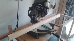 This saw has been outfitted with a wood fence.  I screw it into the metal fence, then run a test cut.  I end up with a perfect kerf which tells me exactly where my cut line will be and a strong surface for clamping.  I can also mark it for individual projects, such as cutting pen blanks.
